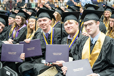 Photo of a graduate students. Photo of a student working on a laptop